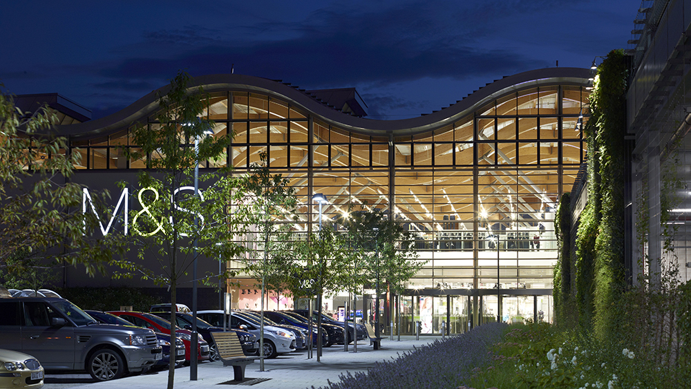 The Cheshire Oaks branch of Marks and Spencer department store at night in Cheshire, United Kingdom.